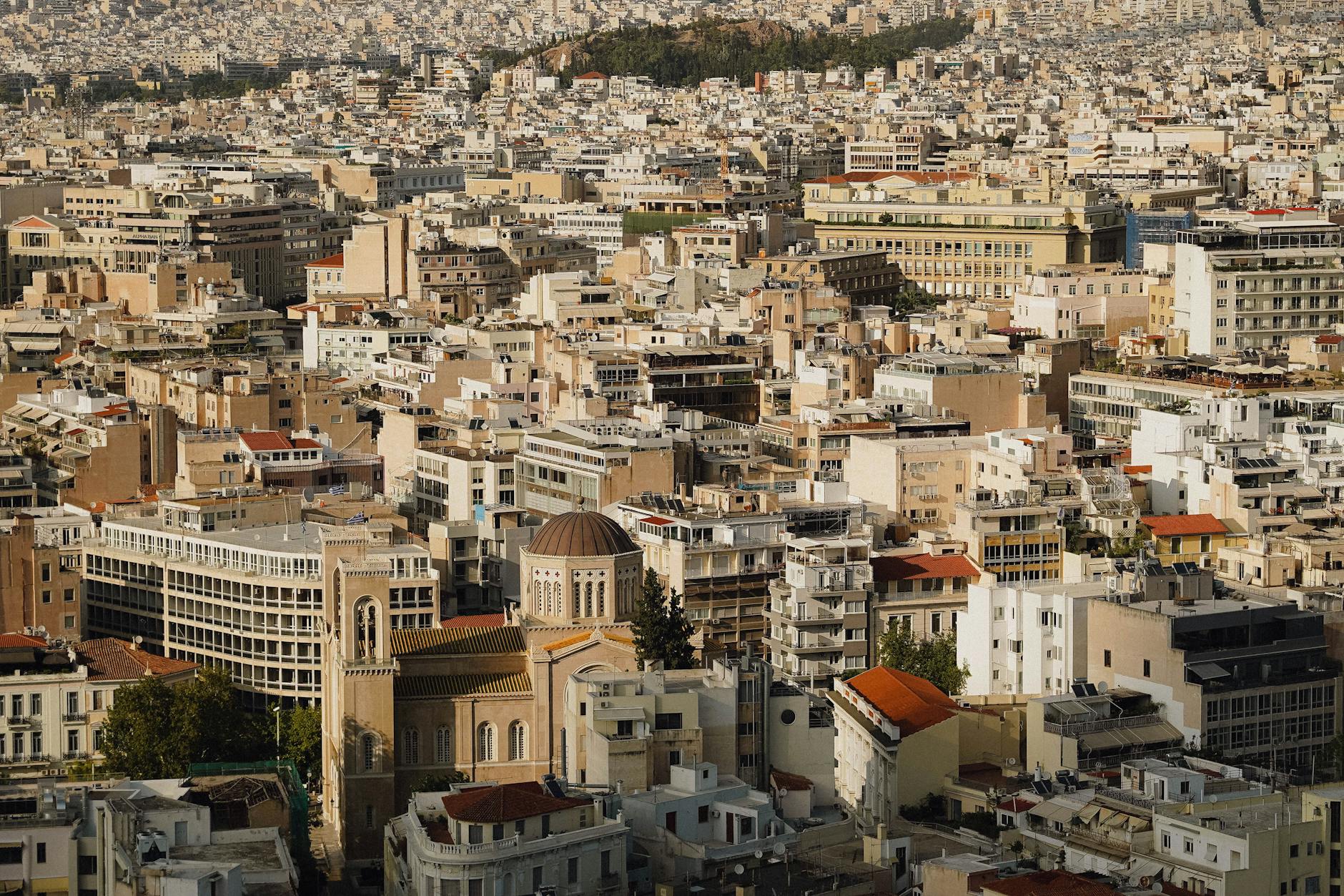 Breathtaking aerial view of Athens cityscape showcasing dense architecture and historic buildings.