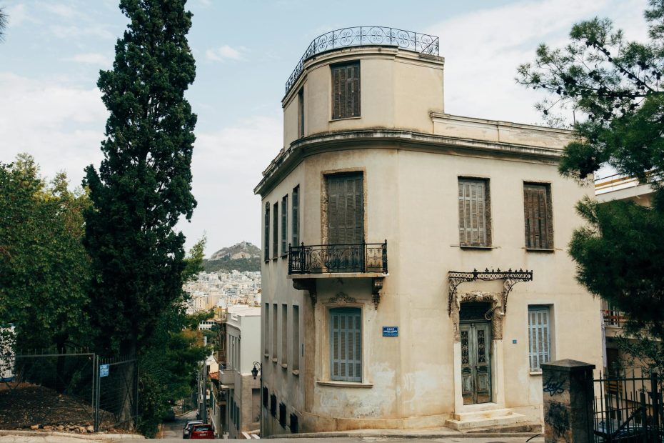 Explore a picturesque historical building in Athens' residential district, capturing classic architecture.