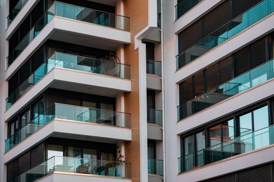 Contemporary architecture showcasing glass balconies and sleek design.